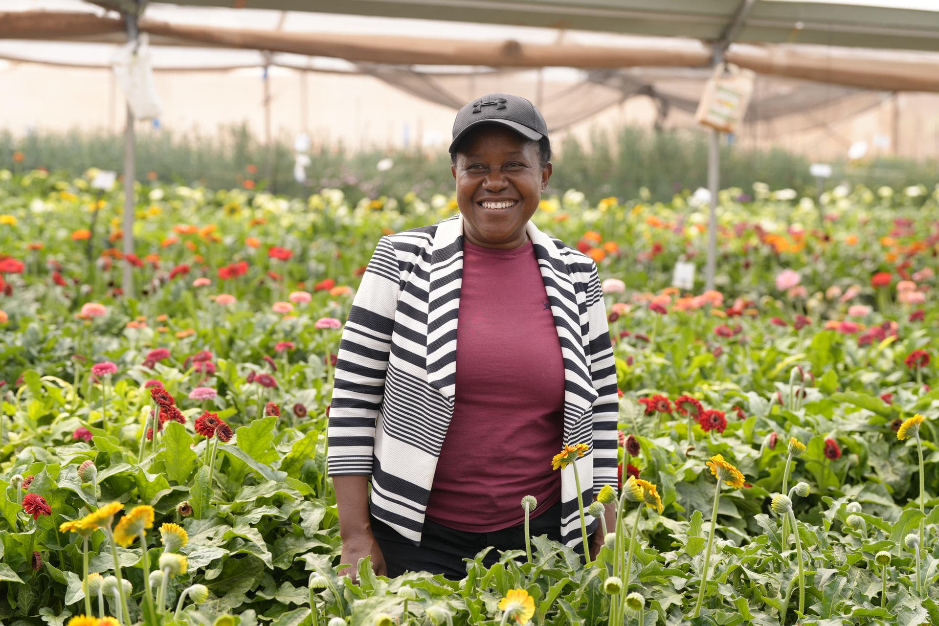Maria Musiska in a Hillview Blossoms greenhouse